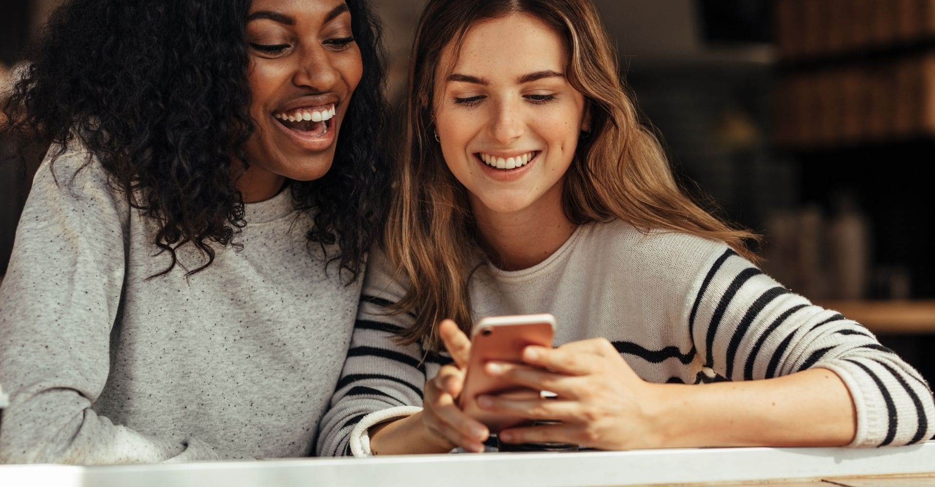 friends looking at phone