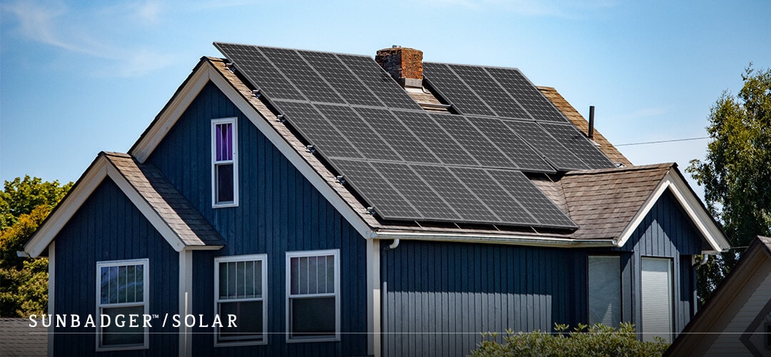 blue house with solar panels